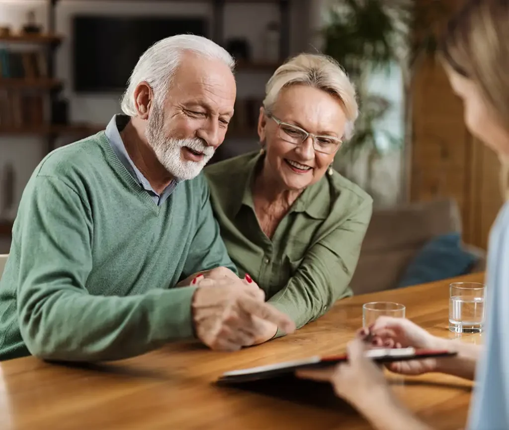 financial advisor meeting with pre retirees to discuss planning for retirement