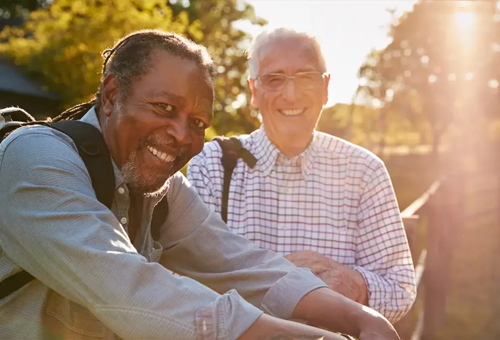 portrait of senior friends outdoors planning for retirement